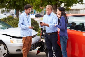 Two Drivers Exchange Insurance Details After Accident