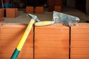 Hammer and trowel on construction site