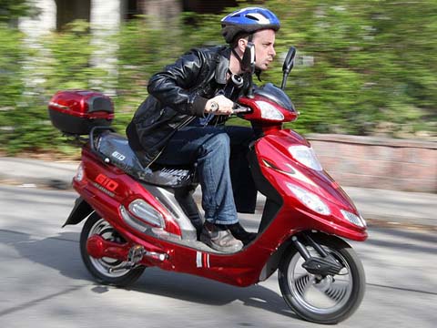 In many jurisdictions, even electric scooters like this are considered to be bicycles (and therefore exempt from insurance requirements) so long as they have pedals.